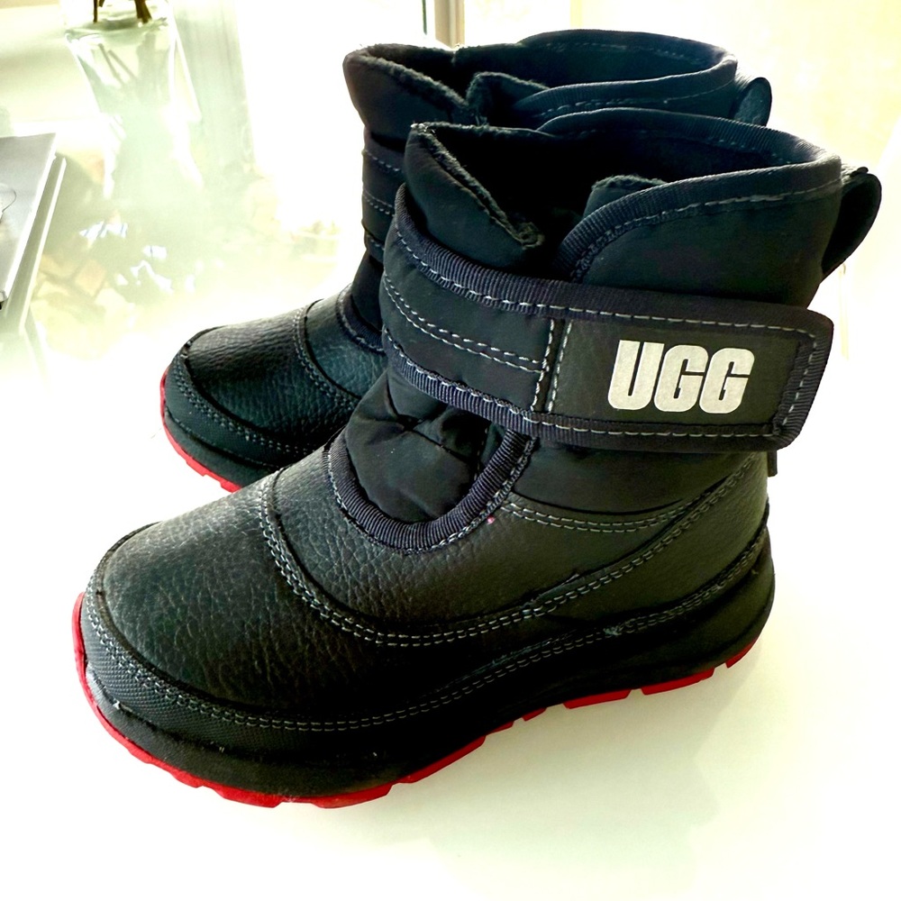 NWT UGG Kids Taney Weather Boots.
Toddler size 9. Black Boots with Red Soles